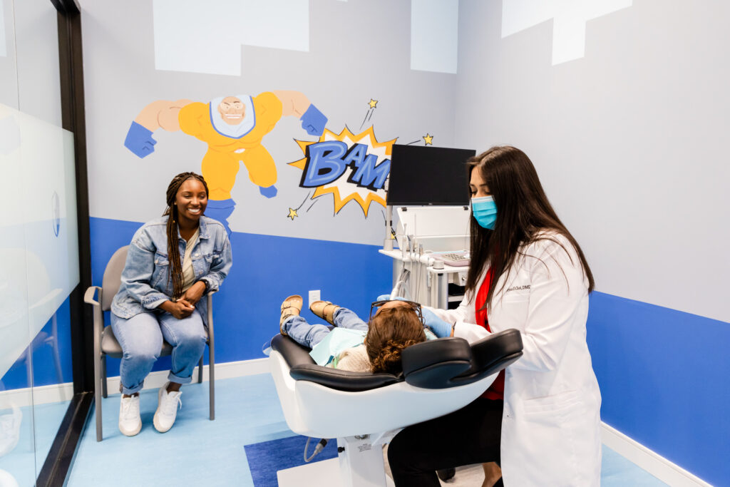 dentist with a baby at our pediatric dentistry in Gainesville, VA.