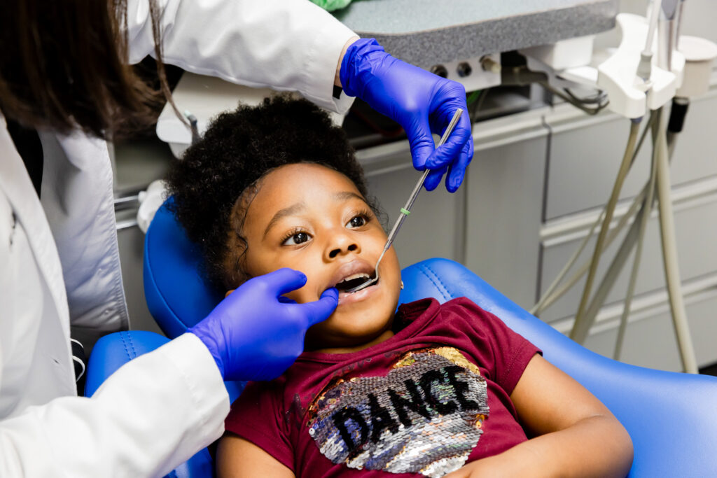 Dentist with a patient during her dental checkup at our Herndon dental office.