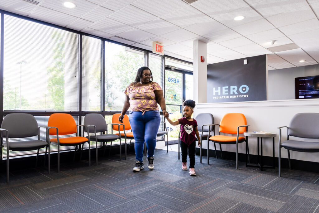 Mom with her patient on their way to see our emergency pediatric dentist in Herndon, VA.